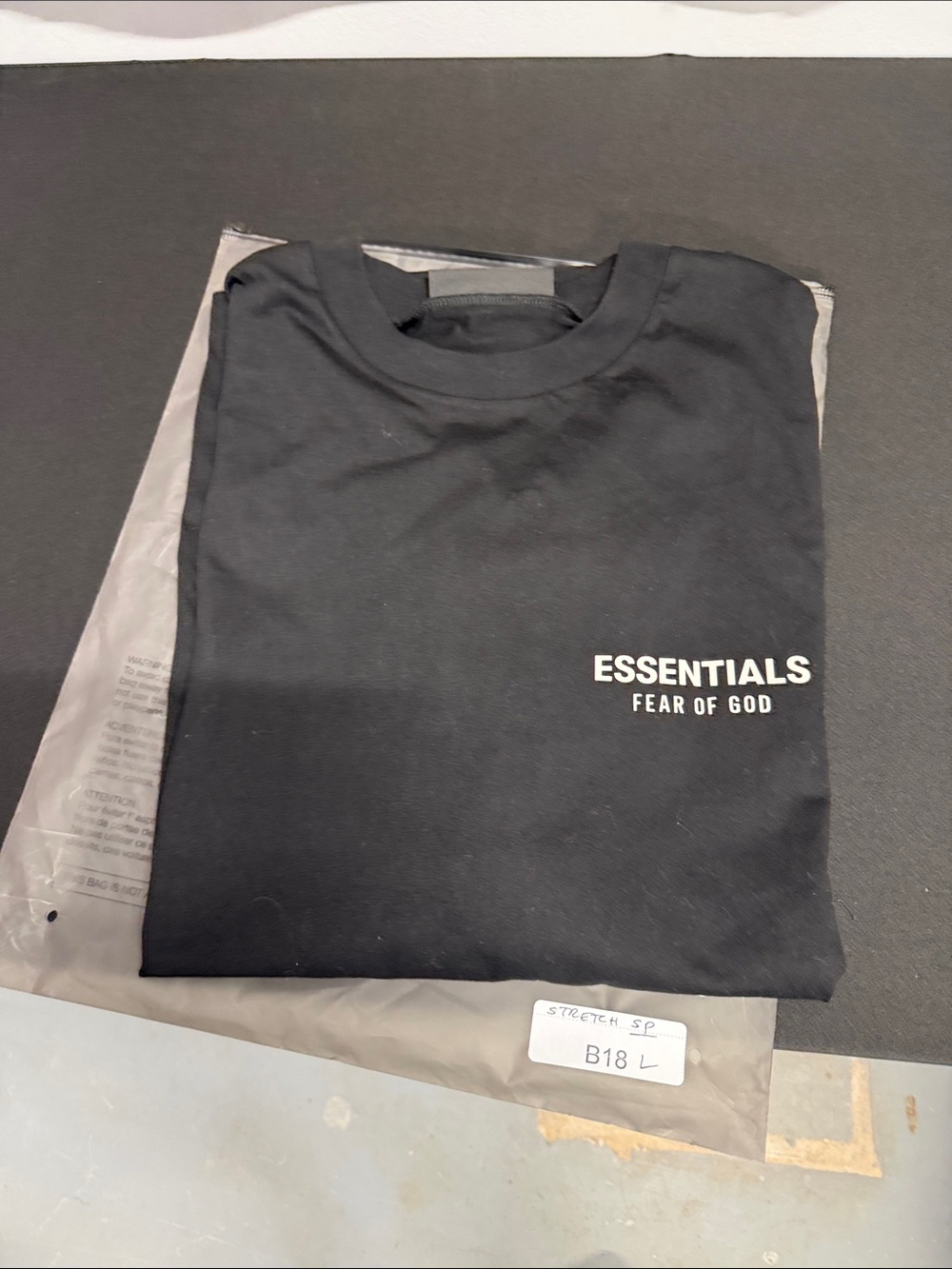 Fear of God ESSENTIALS Black Tee with White Logo